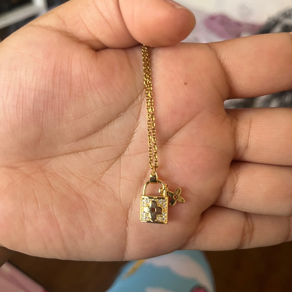 Stainless steel necklace with a lock charm